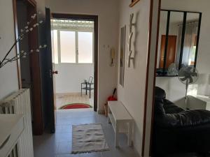 a living room with a black leather couch and a door at Beautiful Apartment with View in Penne 103 m² in Penne +99 photos