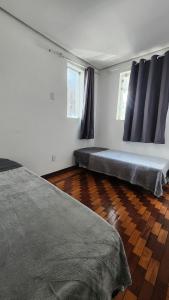 Voodi või voodid majutusasutuse Casa para até 16 pessoas no Lurdes, perto da Savassi BH toas