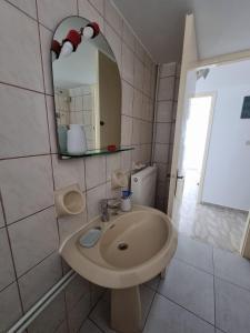 a bathroom with a sink and a mirror at Drymonas Sunset in Drymonas +35 photos
