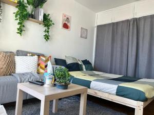Ένα ή περισσότερα κρεβάτια σε δωμάτιο στο Résidence cosy Paris sud