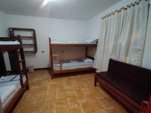 a room with two bunk beds and a couch at Welcome Home Cali in Cali