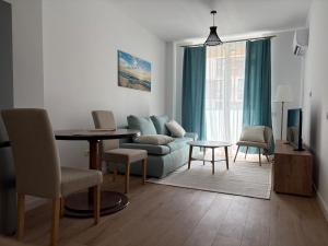 a living room with a couch and a table at A&A Appartment 2 in Timişoara