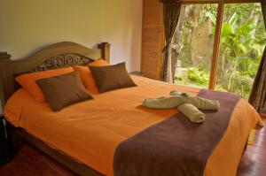 Postel nebo postele na pokoji v ubytování Hotel Campestre Rocas Del Paraíso