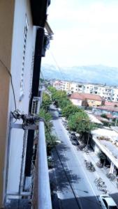 a view of a street from a balcony of a building at Qetesia Apartment in Shkodër