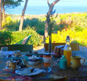 a table with food and a bottle of orange juice at Al Castelluccio in San Vincenzo