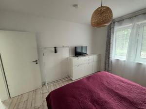 Ένα ή περισσότερα κρεβάτια σε δωμάτιο στο Haus Anna U