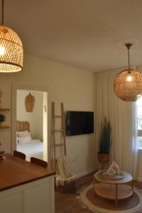 a living room with a room with a bed and a table at כרמי הכפר in Kefar Barukh +31 photos