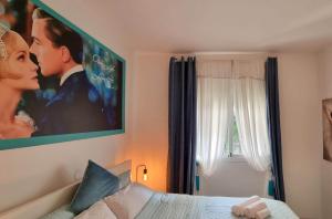 a bedroom with a picture of a bride and groom at DiCaprio - Sunset Ritual incl I by MovieStar Holidays in Mijas Costa +163 photos