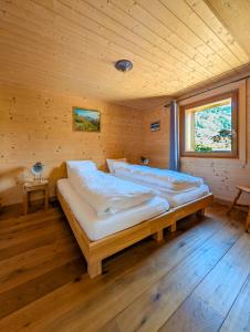 Vuode tai vuoteita majoituspaikassa Luxueux Chalet au centre de Champéry vue panoramique