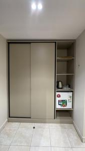 a room with sliding glass doors and a stove at طارق الطائف in Taif +8 photos