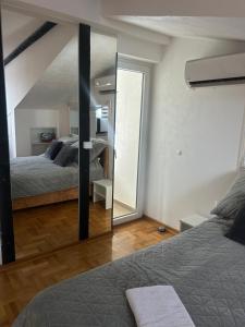 Postel nebo postele na pokoji v ubytování MM Apartman