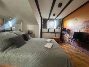 Postel nebo postele na pokoji v ubytování MM Apartman + 8 fotografií