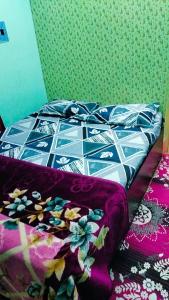 Ένα ή περισσότερα κρεβάτια σε δωμάτιο στο Honey home stay 2BHK
