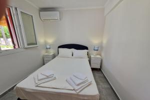 Postel nebo postele na pokoji v ubytování Aggelikis house