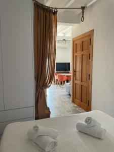 a bedroom with two towels on a bed with a table at H&B COSTABLANCA in Villajoyosa +66 photos