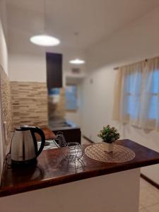 a tea kettle on a counter in a kitchen at Rincon de Golu - Villa General Belgrano in Villa General Belgrano