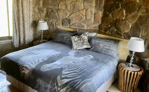 Letto o letti in una camera di Sambane Game Lodge