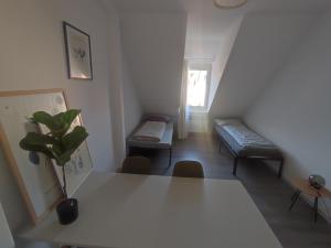 a living room with a white table and chairs at Bright and Spacious Apartment in Wiesbaden City Center in Wiesbaden