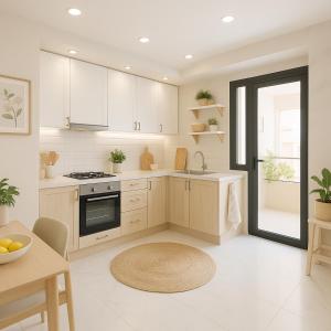 eine Küche mit weißen Schränken und einem Waschbecken und einem Tisch in der Unterkunft aslan appart in Martil