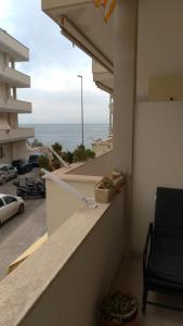 a balcony of a building with a view of the ocean at Casa vacanze " il muretto" in Gallipoli
