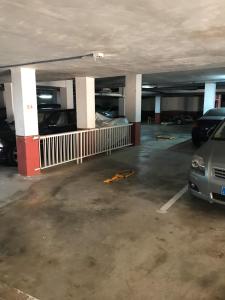 an empty parking garage with cars parked in it at DUPLEX 3 DORMITORIOS en LA MANGA in San Javier