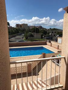 a view of a swimming pool from a balcony at DUPLEX 3 DORMITORIOS en LA MANGA in San Javier