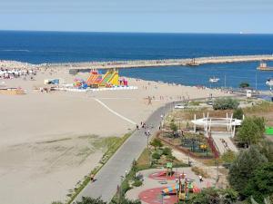 an aerial view of a beach with a playground at Modern Beach Apartment in Constanţa