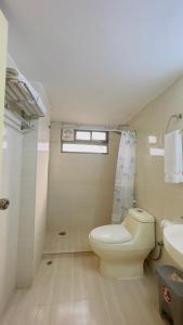 a bathroom with a toilet and a sink at Hotel Grand Circle Inn in Dhaka +47 photos