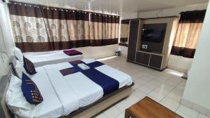 Letto o letti in una camera di Hotel Paradise