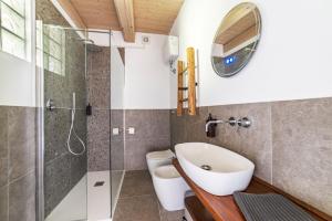 a bathroom with a shower and a sink and a toilet at Libera Mente in Fabriano +82 photos