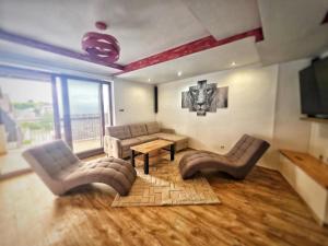 a living room with a couch and a table at Apartmány Alexander in Vrbov