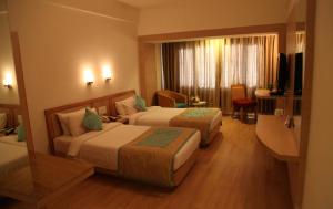 Letto o letti in una camera di IRA By Orchid Bhubaneswar