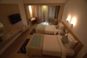 Letto o letti in una camera di IRA By Orchid Bhubaneswar