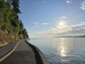 a road next to a body of water at Very Nice Villa in Rødbyhavn in Rødby