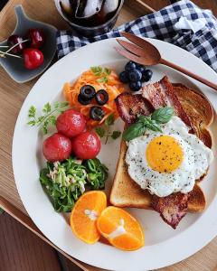 a plate of breakfast food with eggs and toast at L10D10 Hotel in Baku