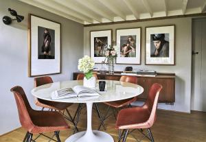 a dining room with a white table and chairs at 3 Bedrooms, 3 Double Beds, 6 Guests, Countryside Thatched Cottage in Four Marks