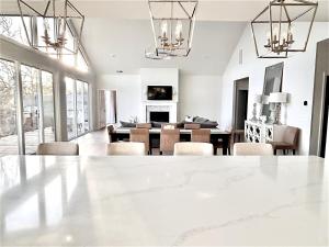 a dining room and living room with a table and chairs at Soul Beach Lake House in Chapin