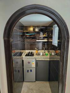 a kitchen with a sink and a counter top at Dar Larbi in Chefchaouene