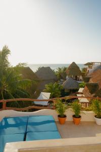 a view of the ocean from a resort patio at Casa Las Tortugas Petit Beach Hotel & Spa in Holbox Island