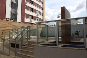 a balcony with stairs and a train in a building at Casa Serena in Brasilia