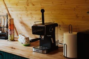 a black sewing machine sitting on a counter at A-Forest Retreat - David's A-frame in Ocna-Mureşului