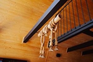 a dream catcher hanging from a ceiling at A-Forest Retreat - David's A-frame in Ocna-Mureşului