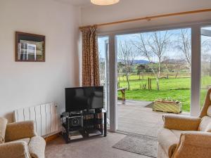 TV a/nebo společenská místnost v ubytování Exmoor View