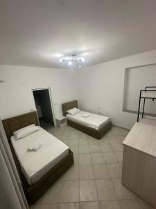 Ένα ή περισσότερα κρεβάτια σε δωμάτιο στο Gold Rooms I