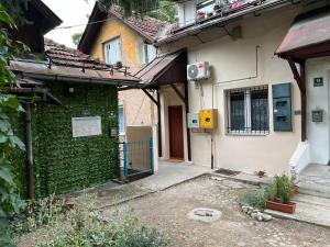 an outside view of a building with a green wall at Urban Heart Residence in Sarajevo