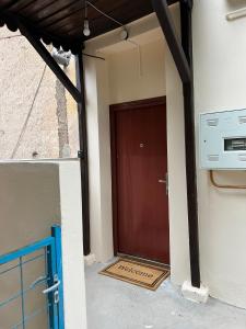 a brown door on the side of a building at Urban Heart Residence in Sarajevo
