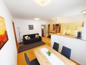 a living room with a table and a couch at Markapartment Passail in Passail