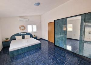 Ein Bett oder Betten in einem Zimmer der Unterkunft Villa Dusper