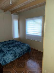 Cama o camas de una habitación en Cabaña rivera del Captrén