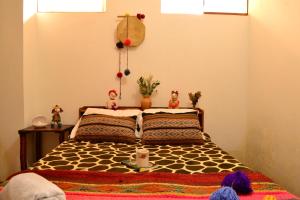 Voodi või voodid majutusasutuse Sacred Valley Mystic Tribe toas